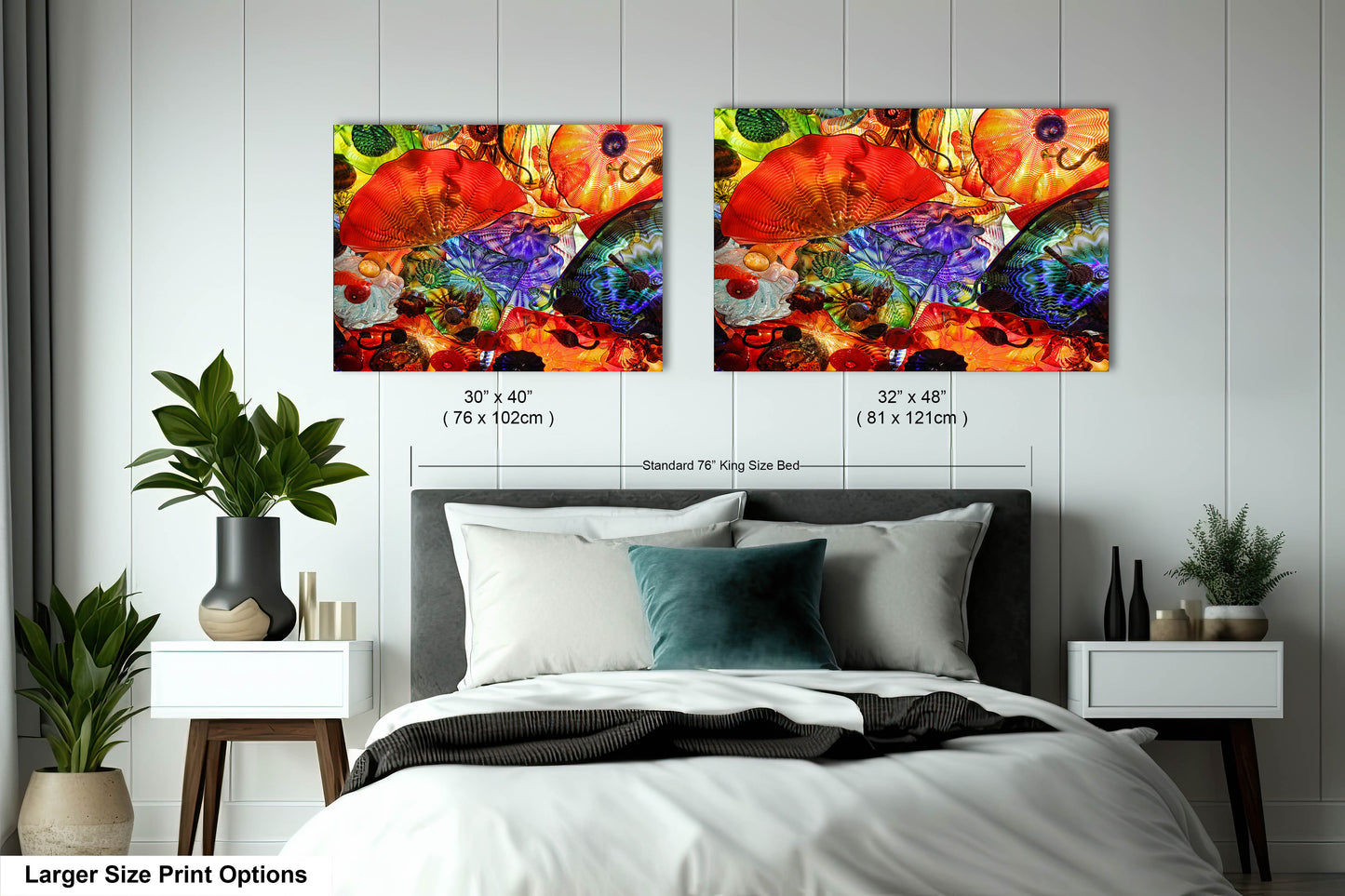 a bedroom with a bed and two paintings on the wall