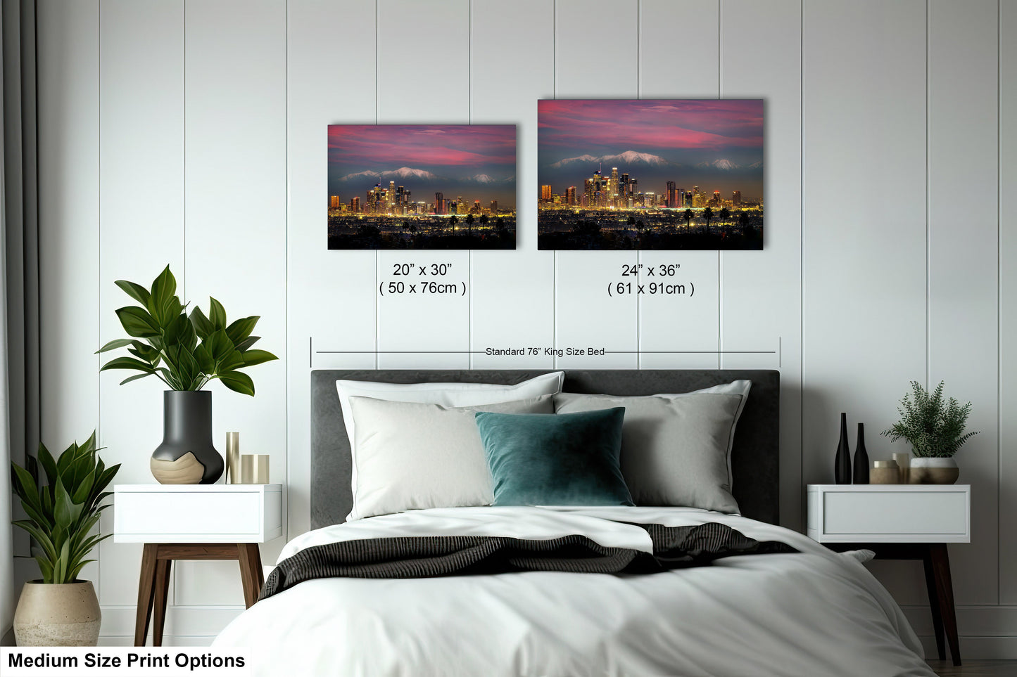 a bedroom with a bed and two pictures on the wall