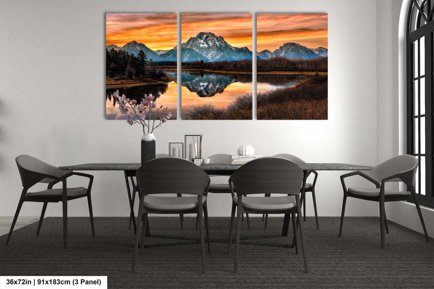 a dining room table with chairs and a painting on the wall