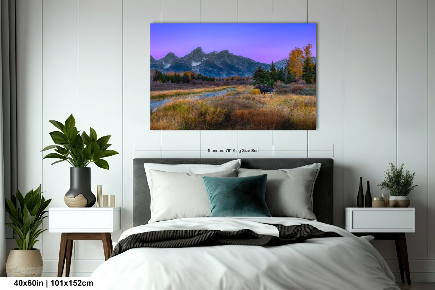 a bedroom with a bed and a painting on the wall