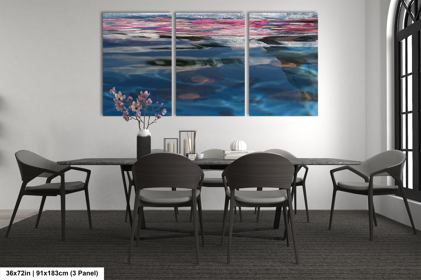 a dining room table with four chairs and a painting on the wall