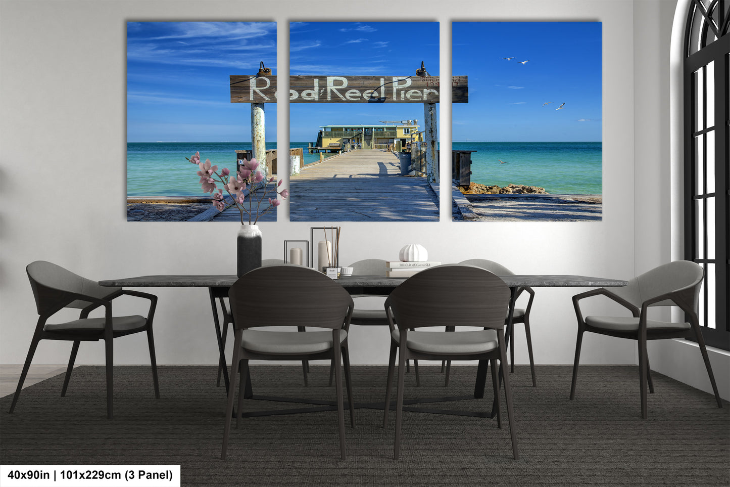 a dining room with a table and four chairs