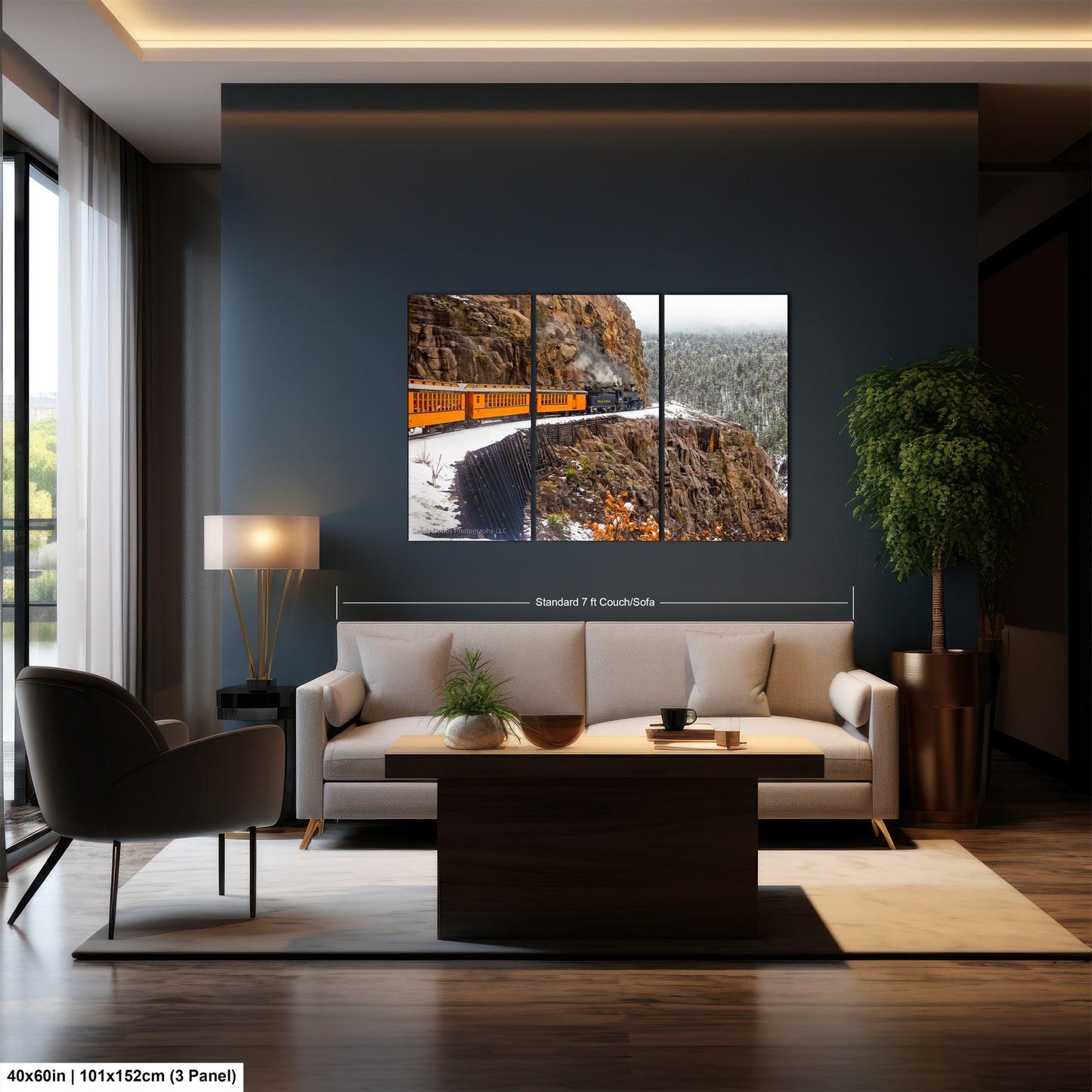 a living room with a couch a table and a painting on the wall