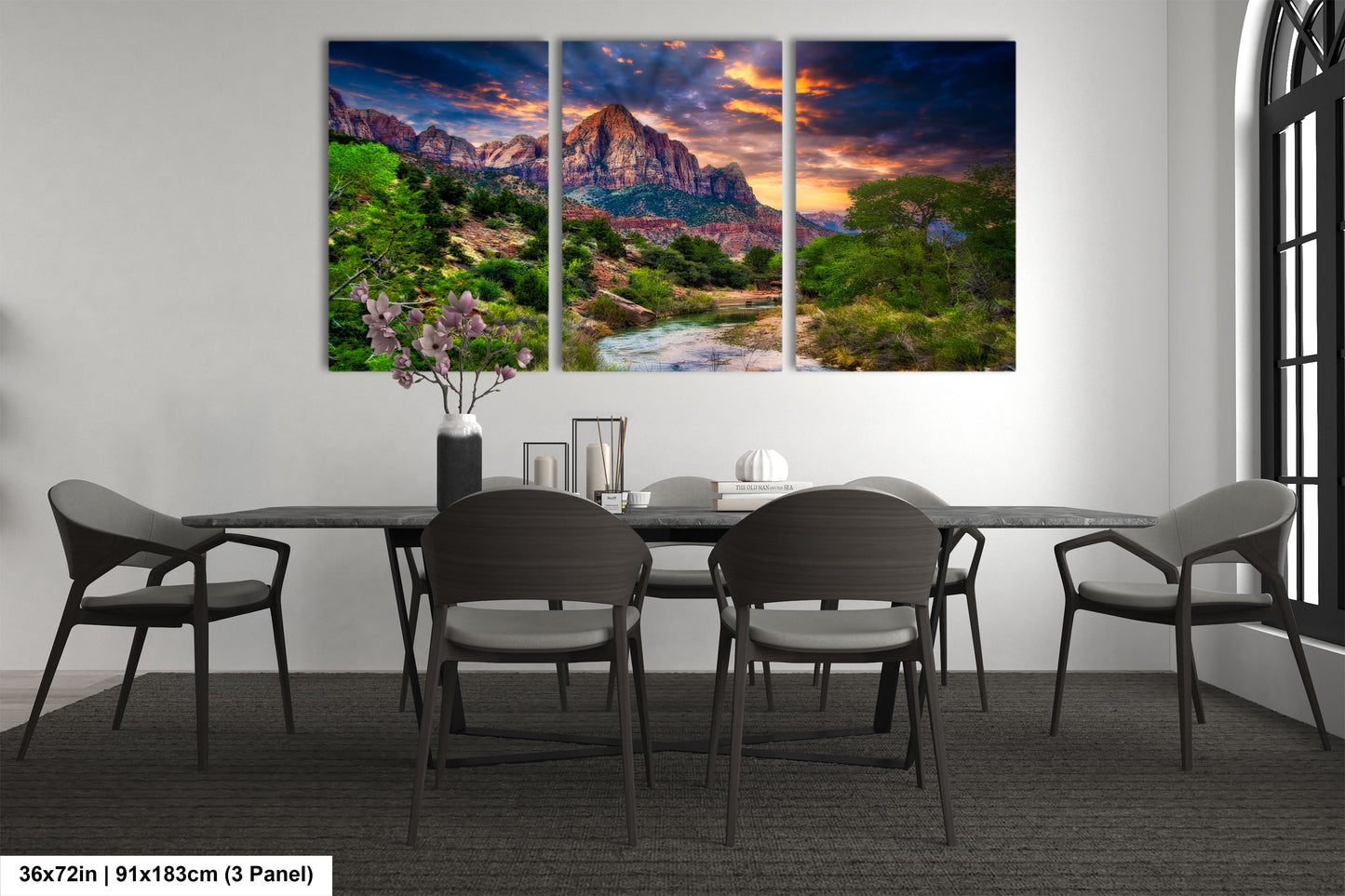 a dining room table with chairs and a painting on the wall