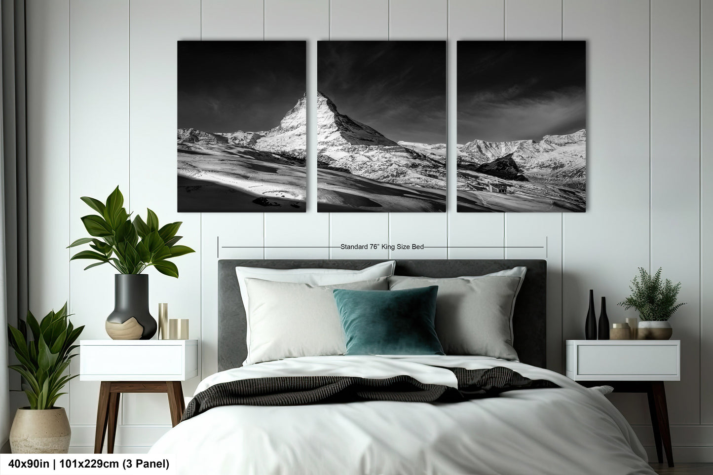 a black and white photo of a bed with a mountain in the background