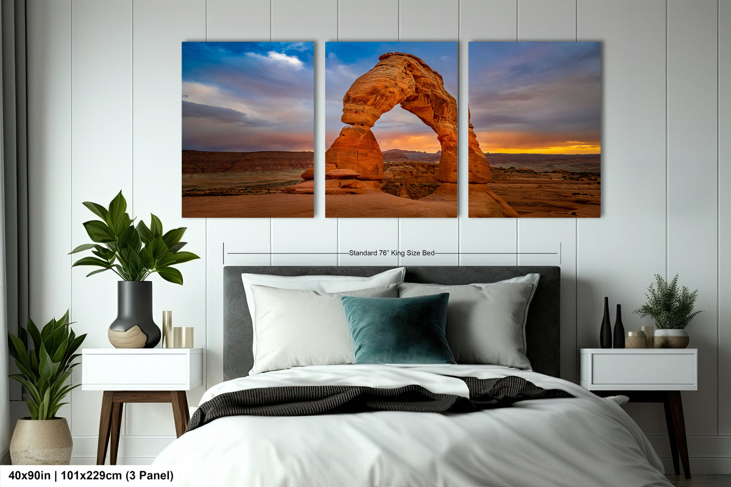 a bed room with a neatly made bed and two pictures on the wall