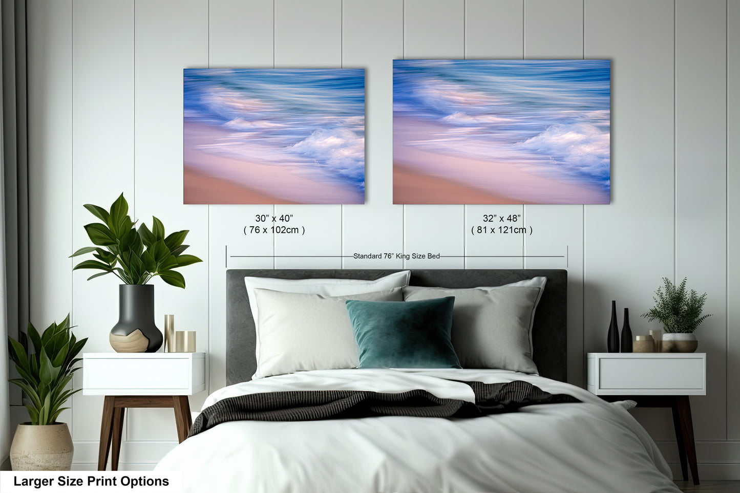 a bed with a white comforter and two pictures on the wall above it