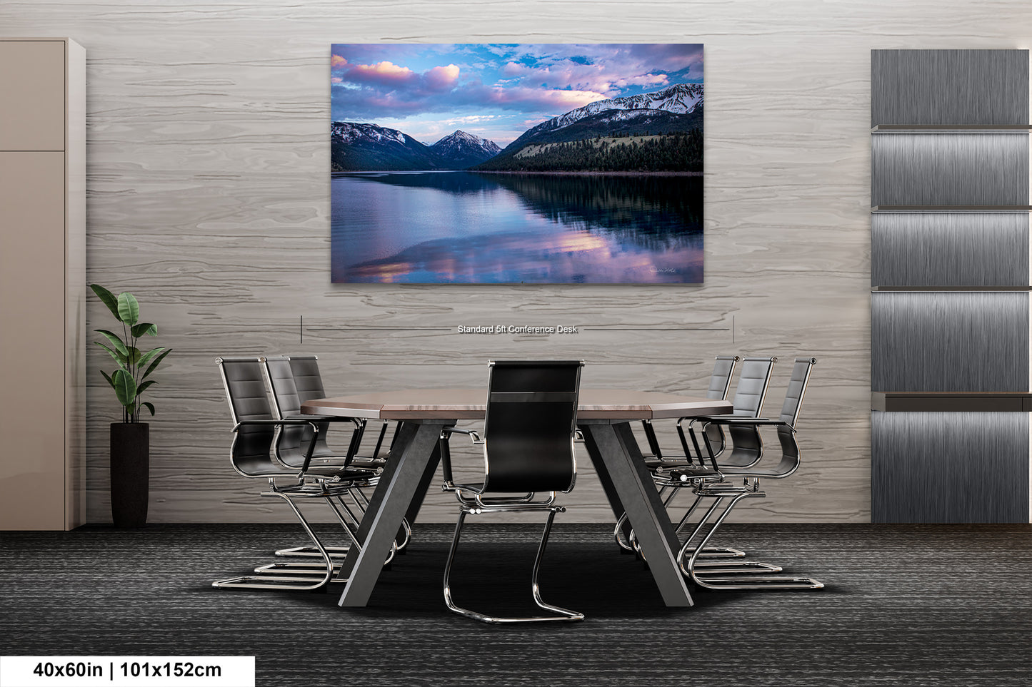 a dining room table with chairs and a painting on the wall