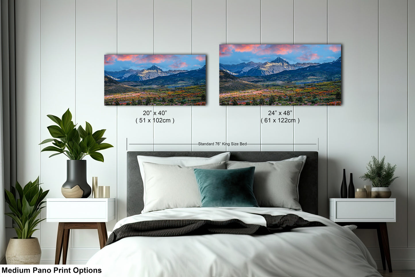 a bedroom with a bed and two pictures on the wall