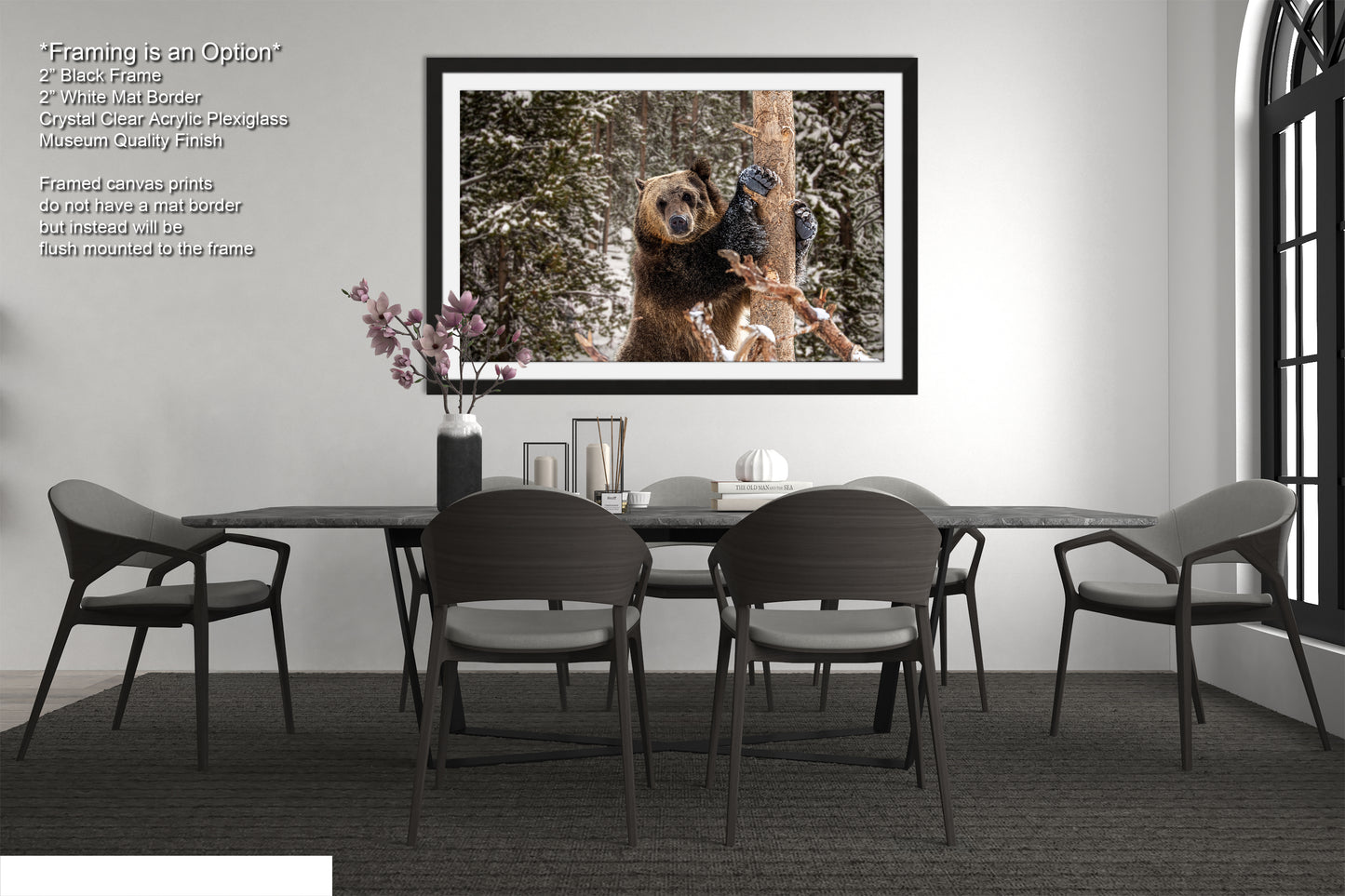 a dining room table with chairs and a picture hanging on the wall
