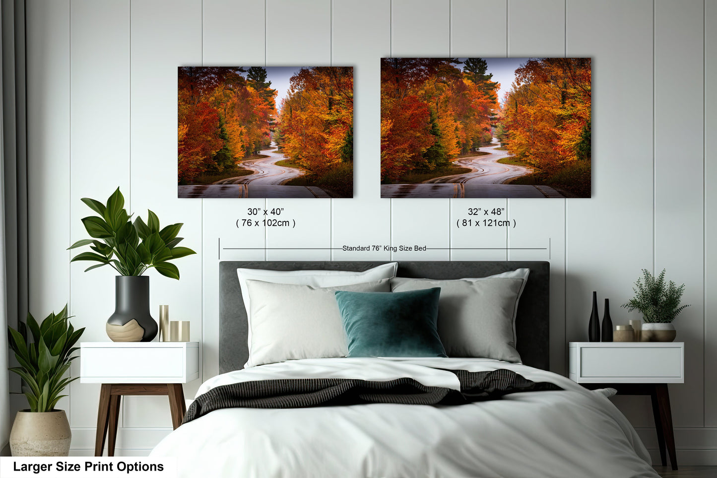 a bedroom with a bed and two pictures on the wall