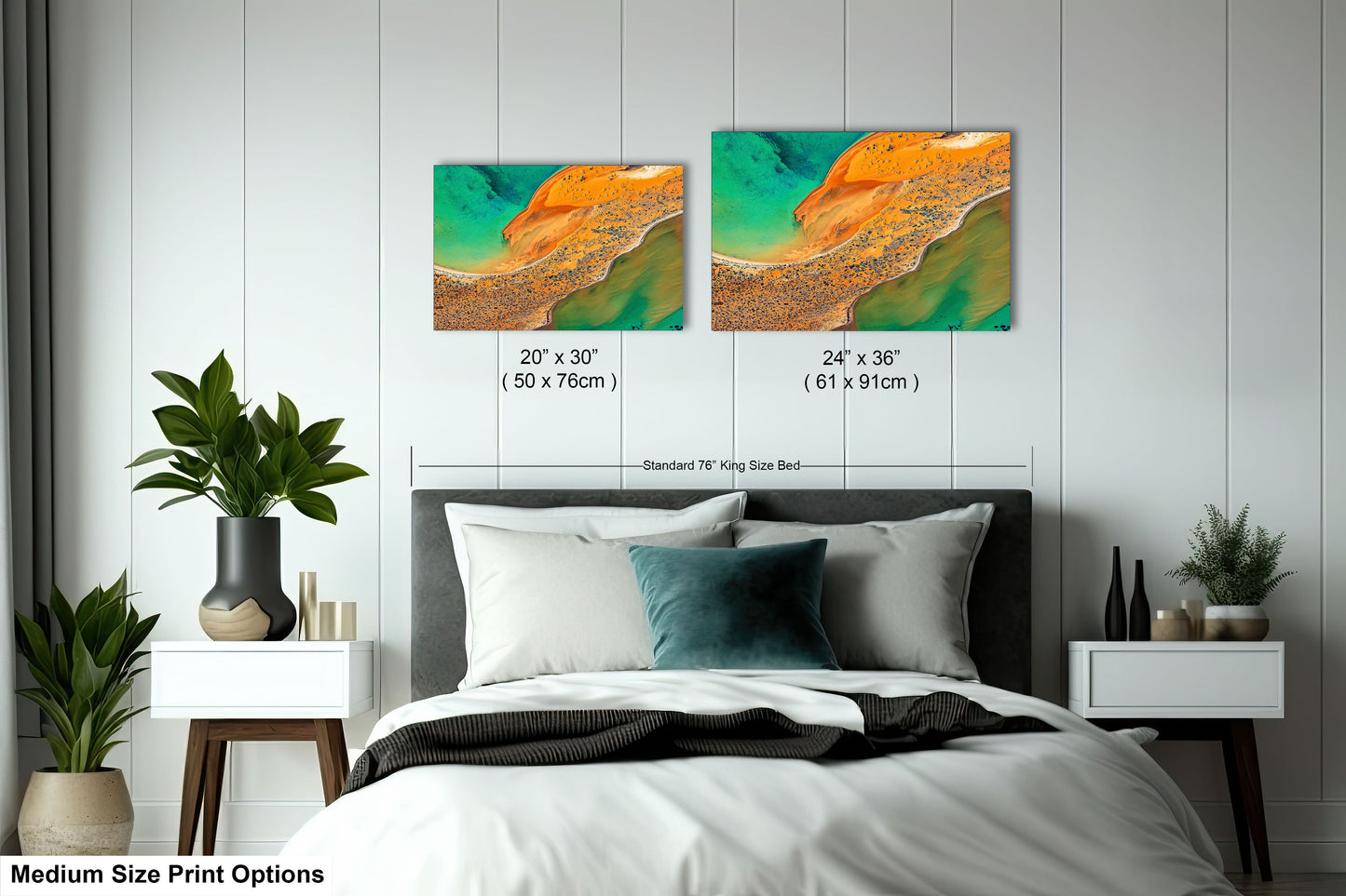 a bed room with a neatly made bed and two paintings on the wall