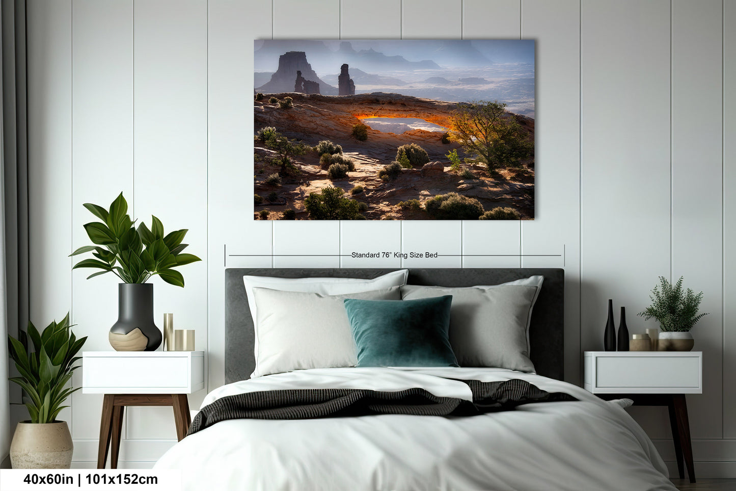 a bedroom with a bed and a painting on the wall