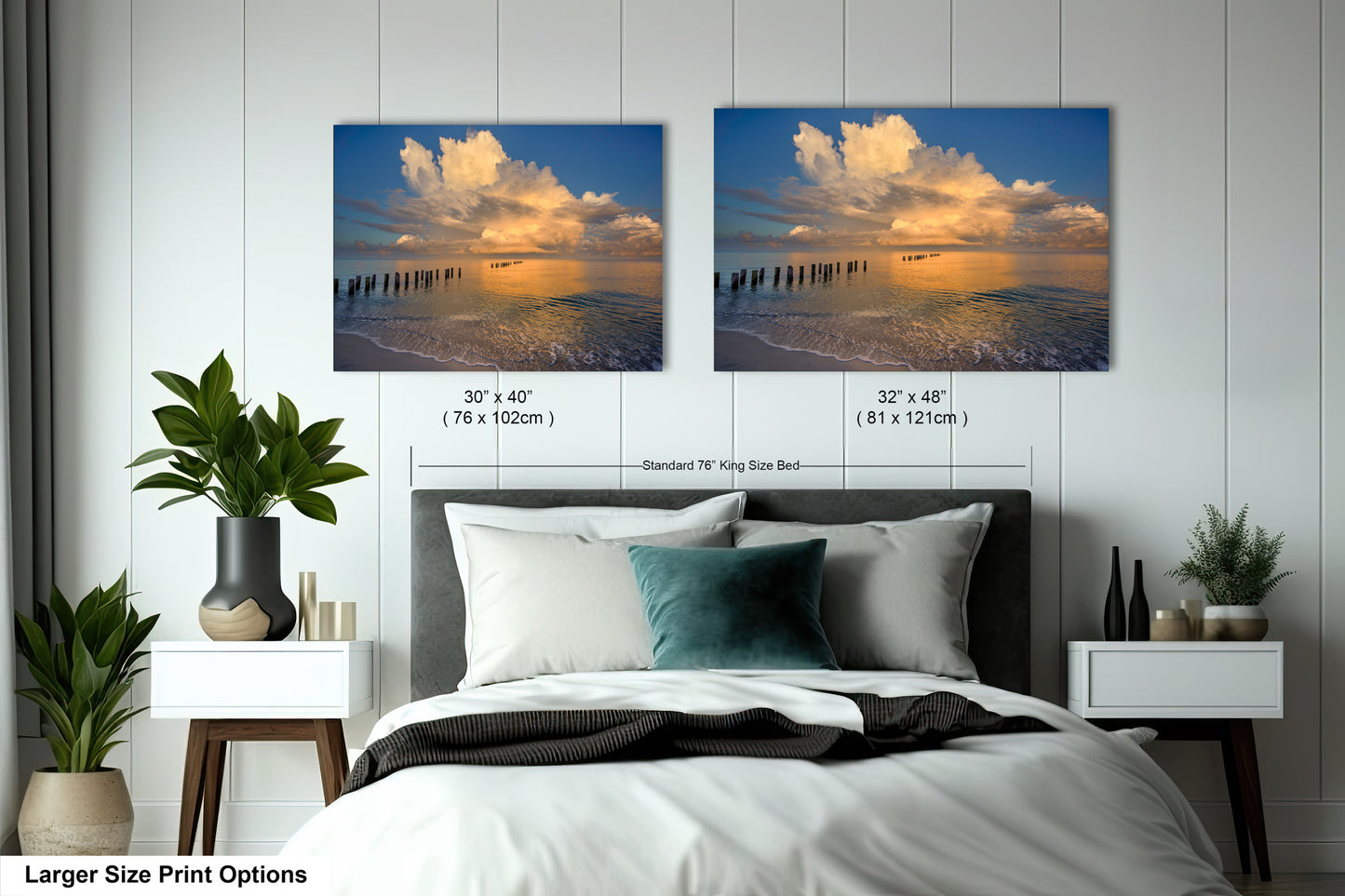 a bedroom with a bed and two pictures on the wall