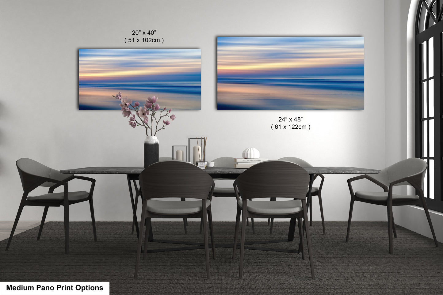 a dining room table with chairs and a vase of flowers