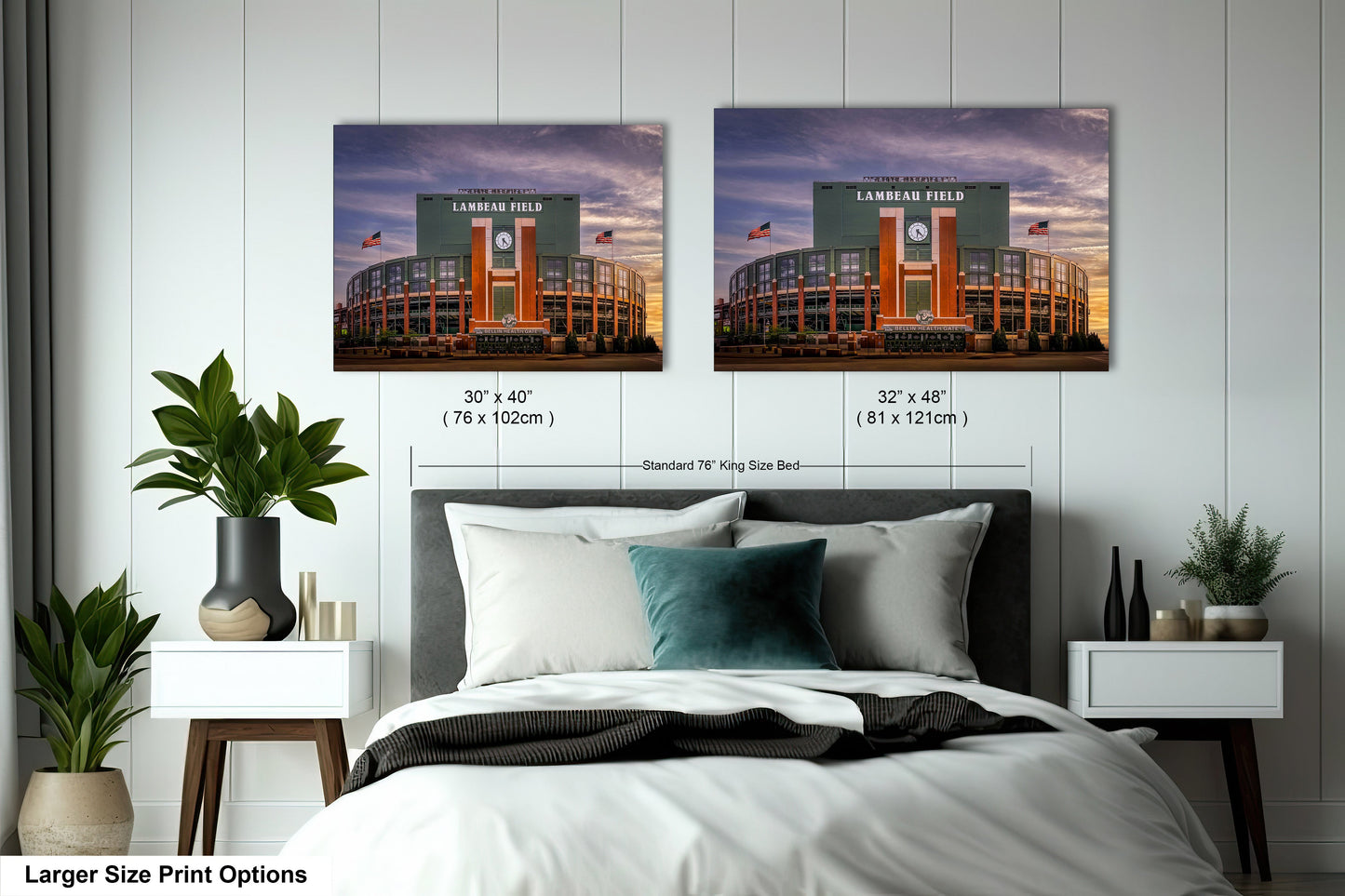 a bed with two pictures on the wall above it