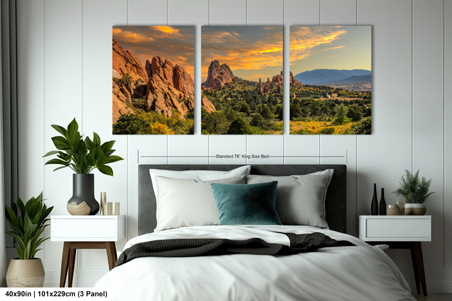 a bedroom scene with a bed and two pictures on the wall
