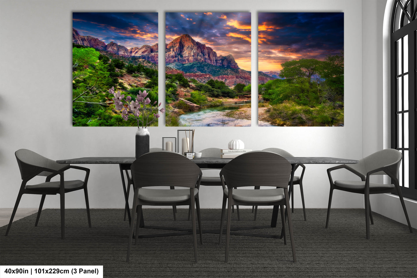a dining room table with four chairs and a painting on the wall