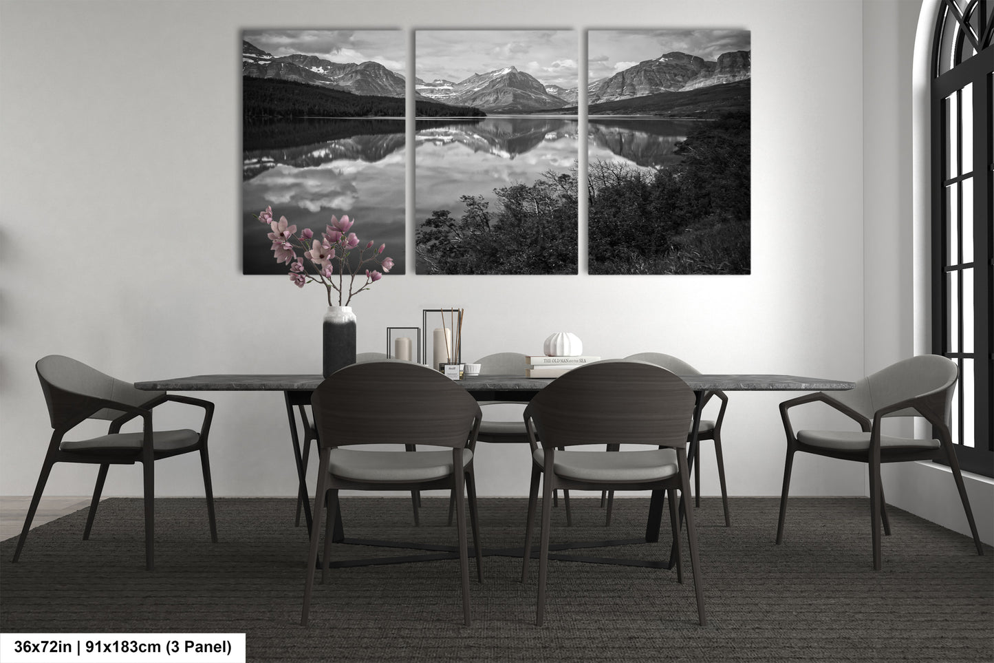 a black and white photo of a dining room table