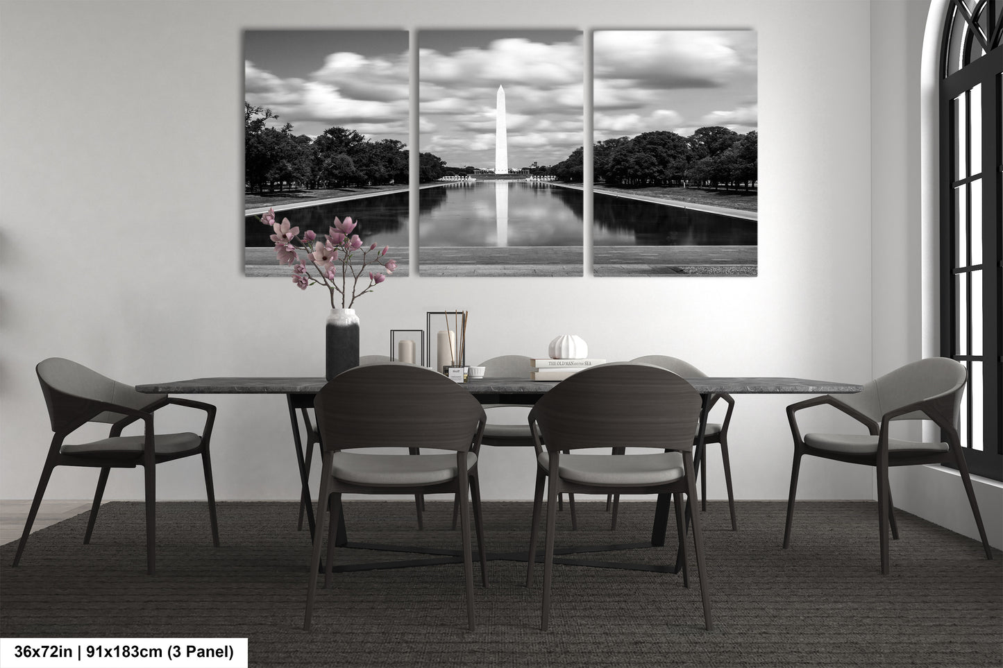 a black and white photo of a dining room table