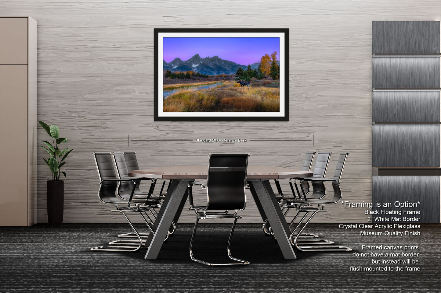 a dining room table with chairs and a picture hanging on the wall
