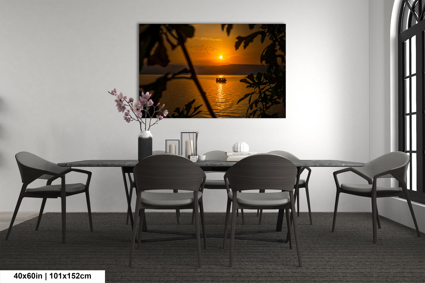 a dining room table with chairs and a vase of flowers