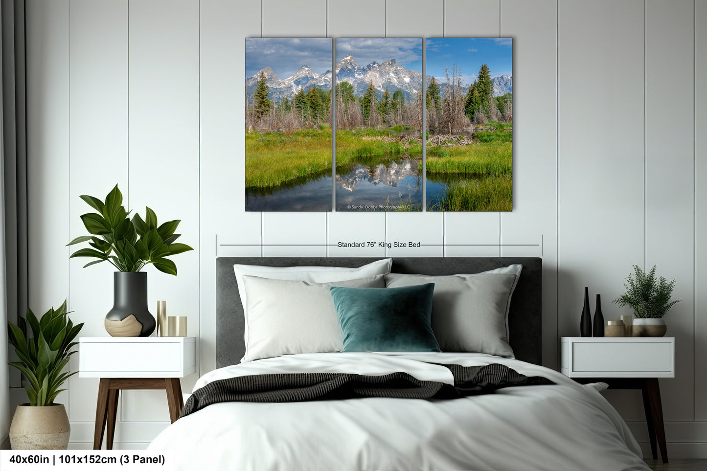 a bed room with a neatly made bed and a painting on the wall