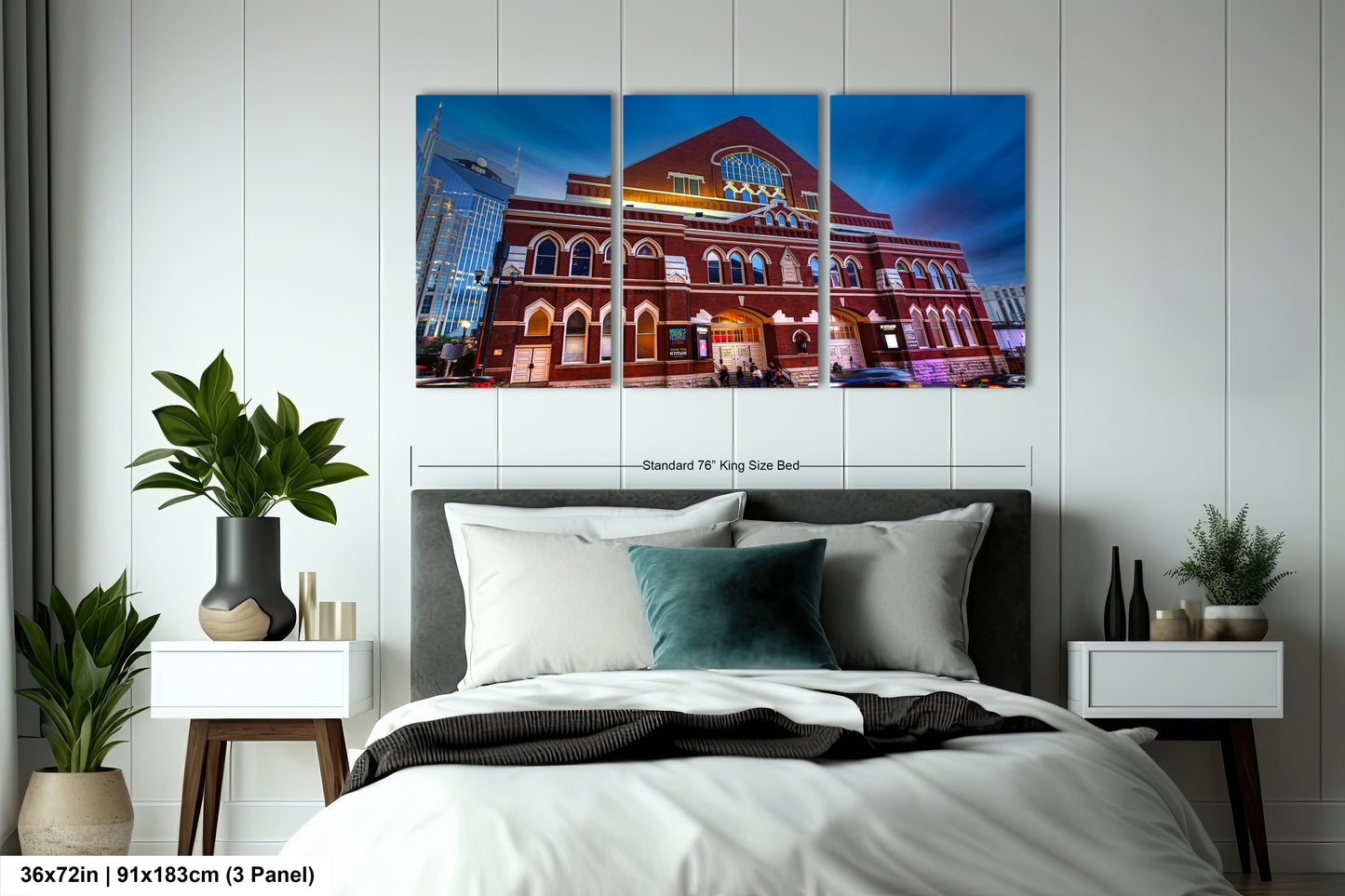a bedroom with a large bed and three paintings on the wall