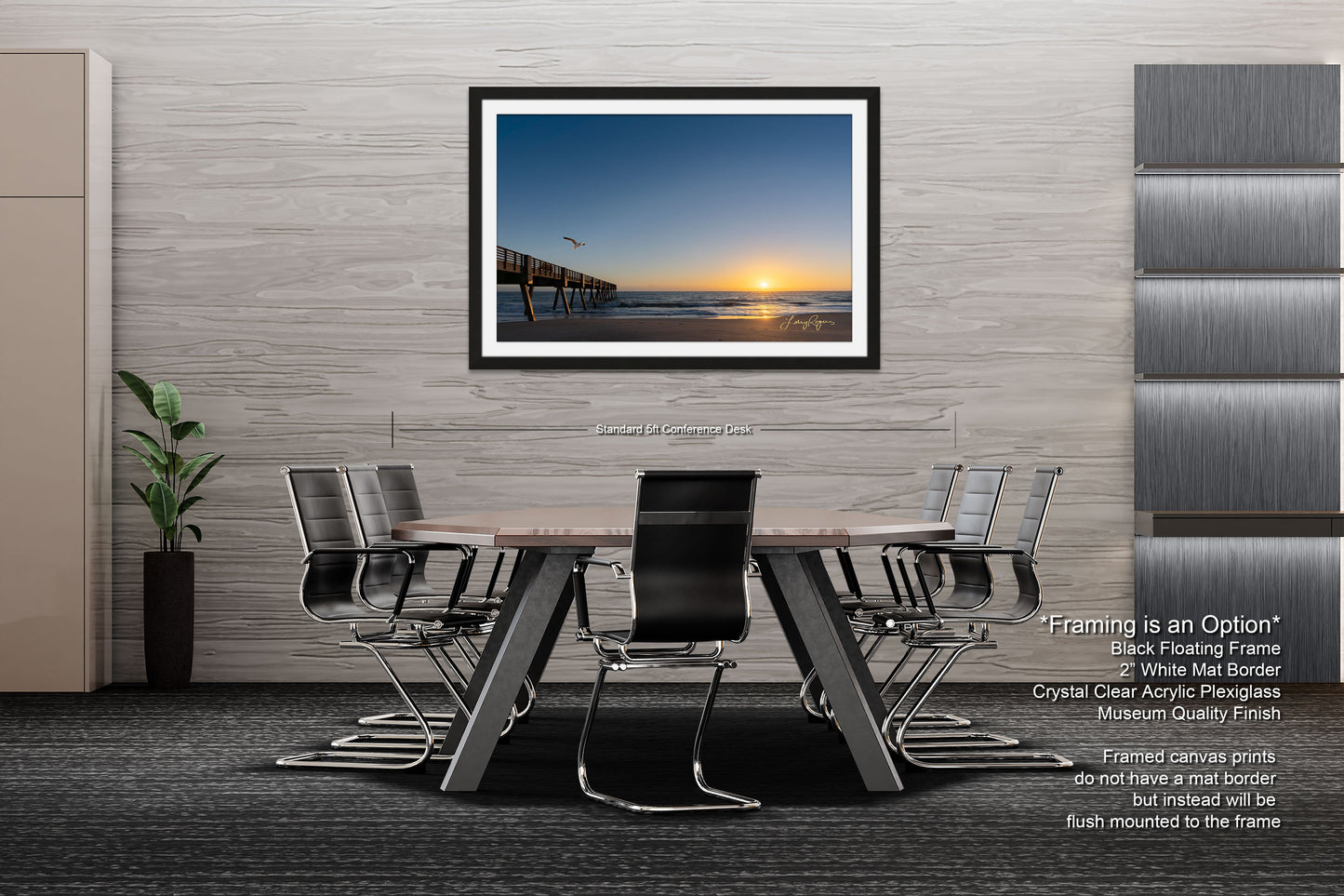 a dining room table with chairs and a picture hanging on the wall