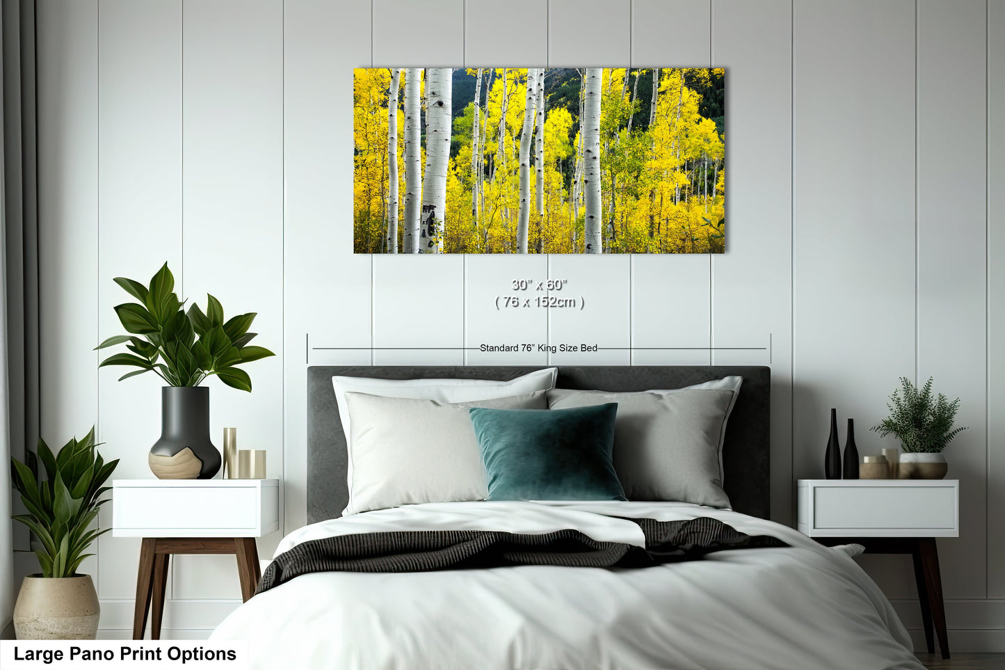 a bed room with a neatly made bed and a painting on the wall