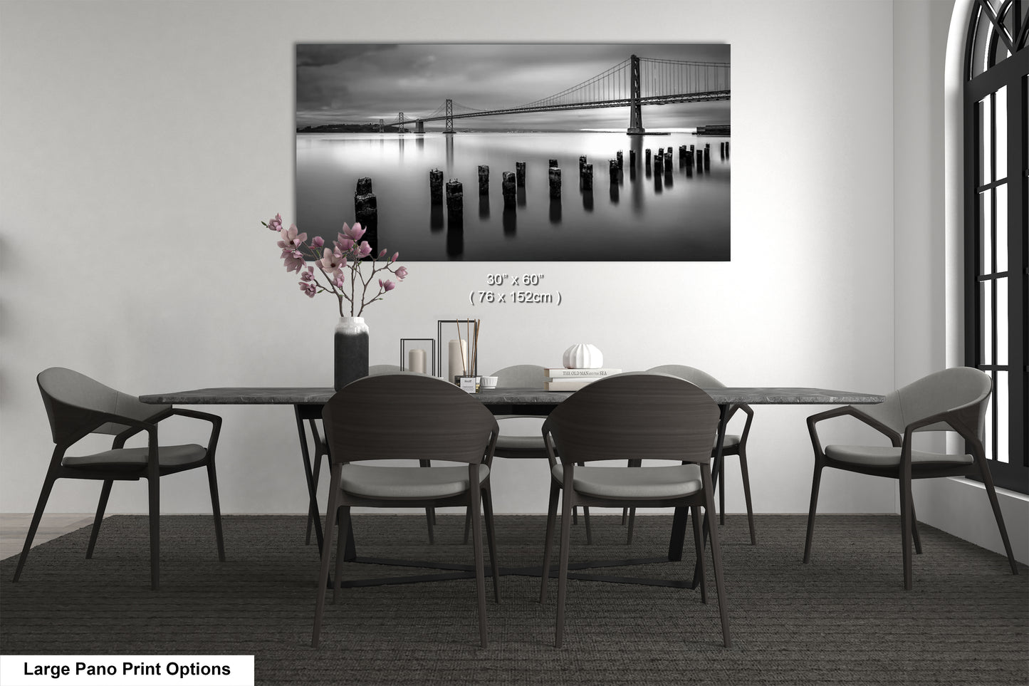 a black and white photo of a table and chairs
