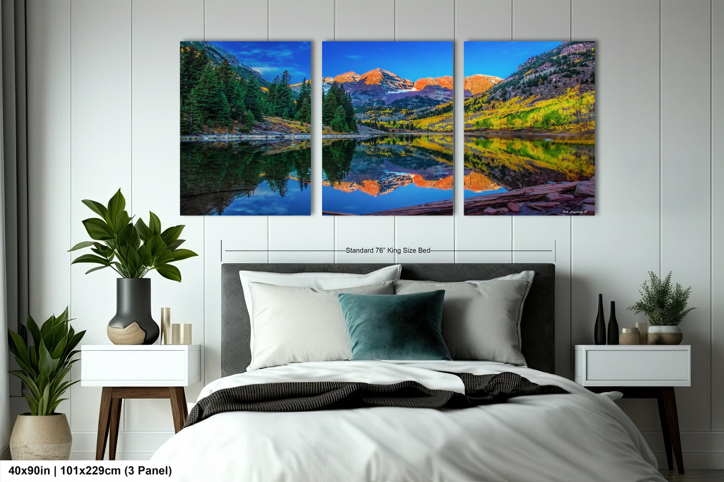 a bedroom scene with a bed and two paintings on the wall