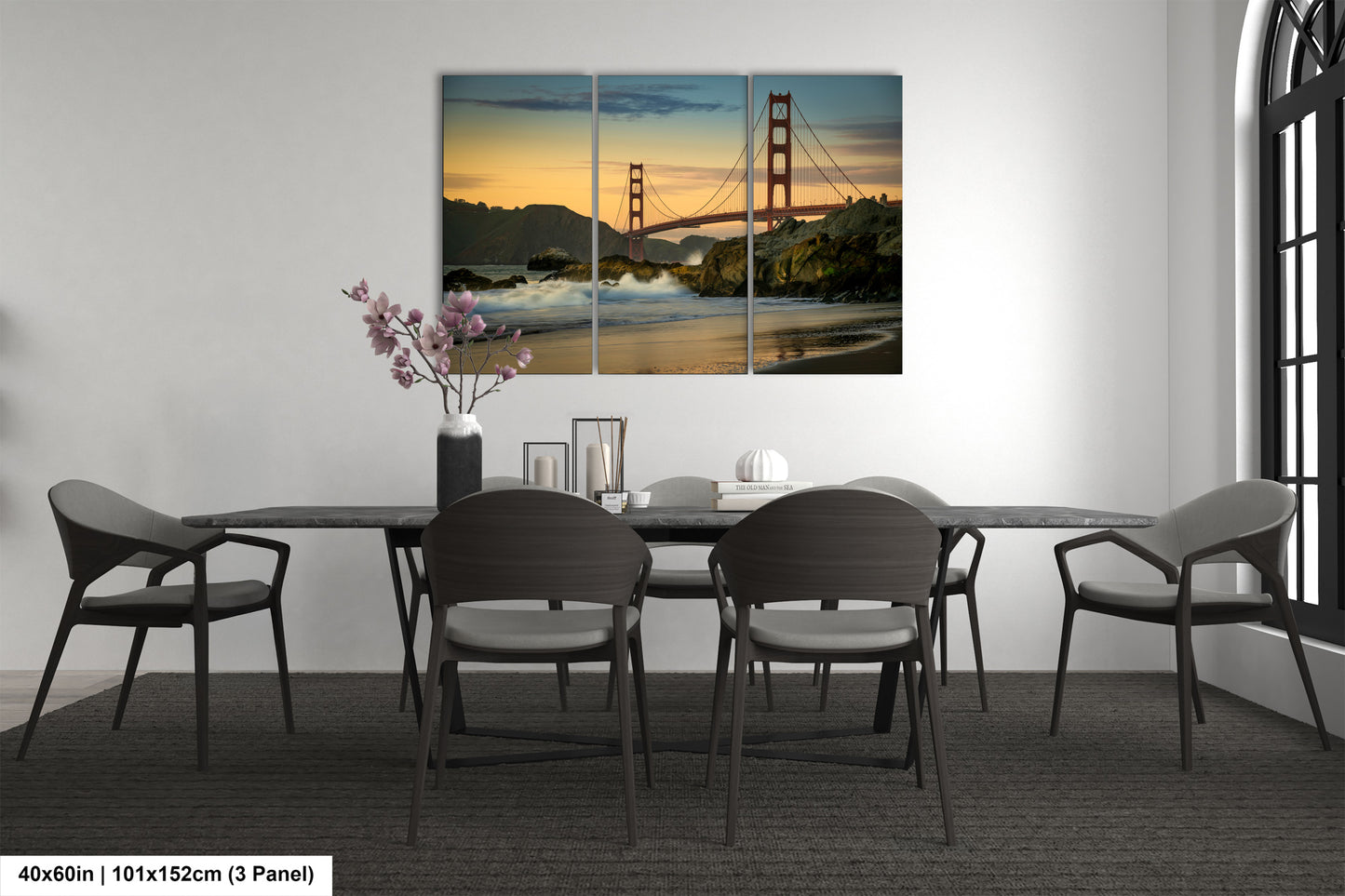 a dining room with a table and chairs and a picture of the golden gate bridge