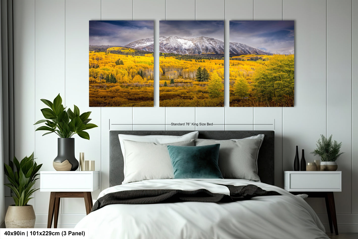 a bed room with a neatly made bed and two pictures on the wall