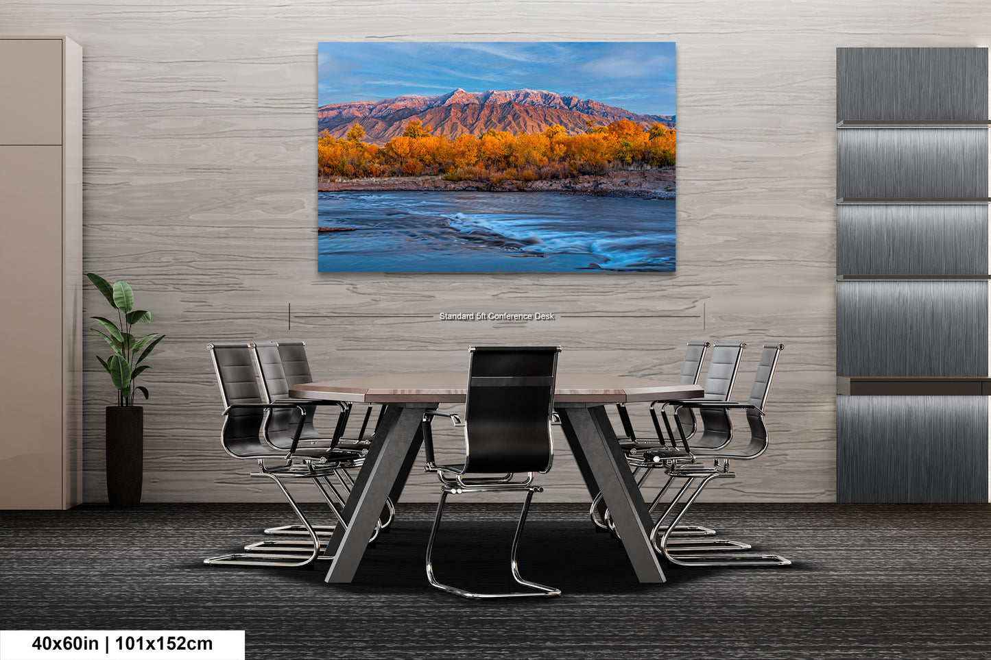 a dining room table with chairs and a painting on the wall