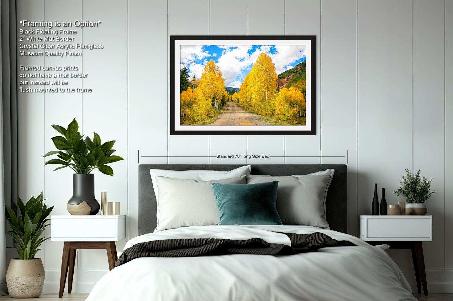 a bedroom with a bed and a picture hanging on the wall