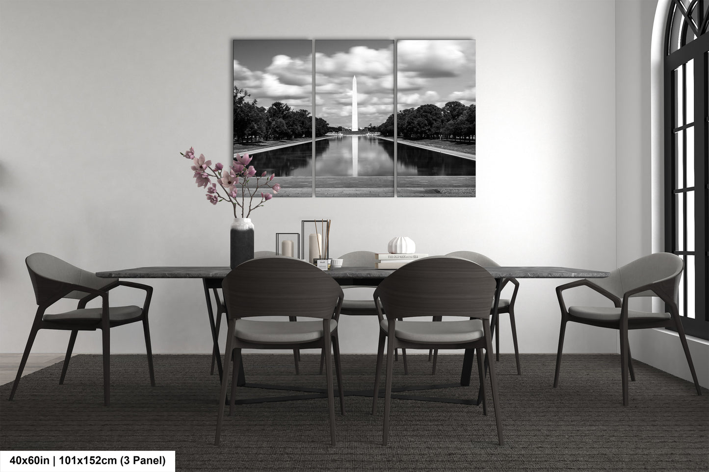 a black and white photo of a dining room table