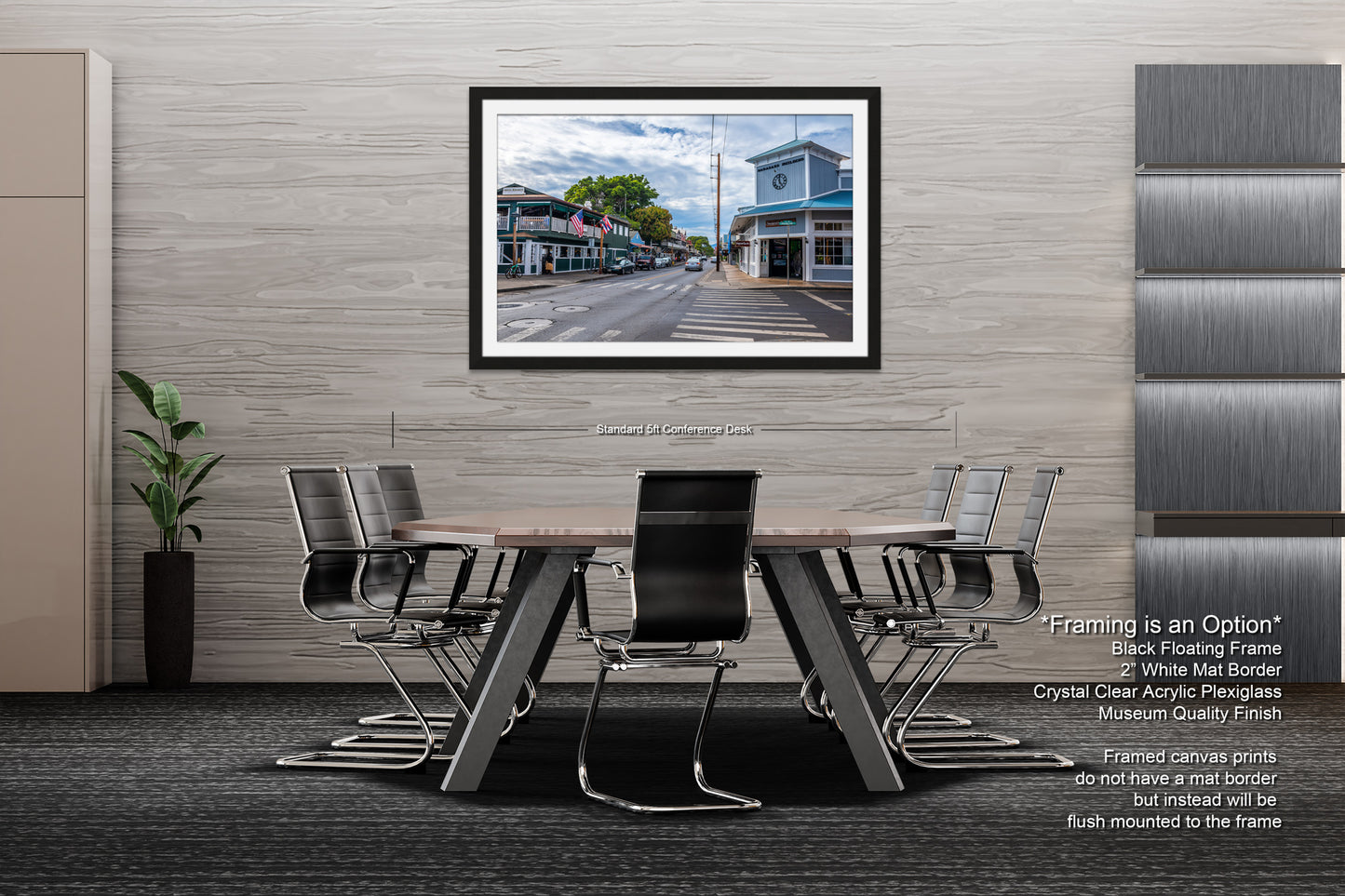 a dining room table with chairs and a picture hanging on the wall