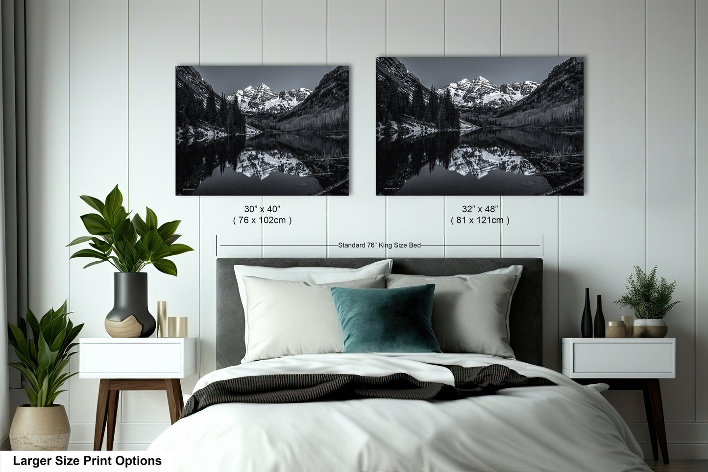 a bedroom with a bed and two pictures on the wall