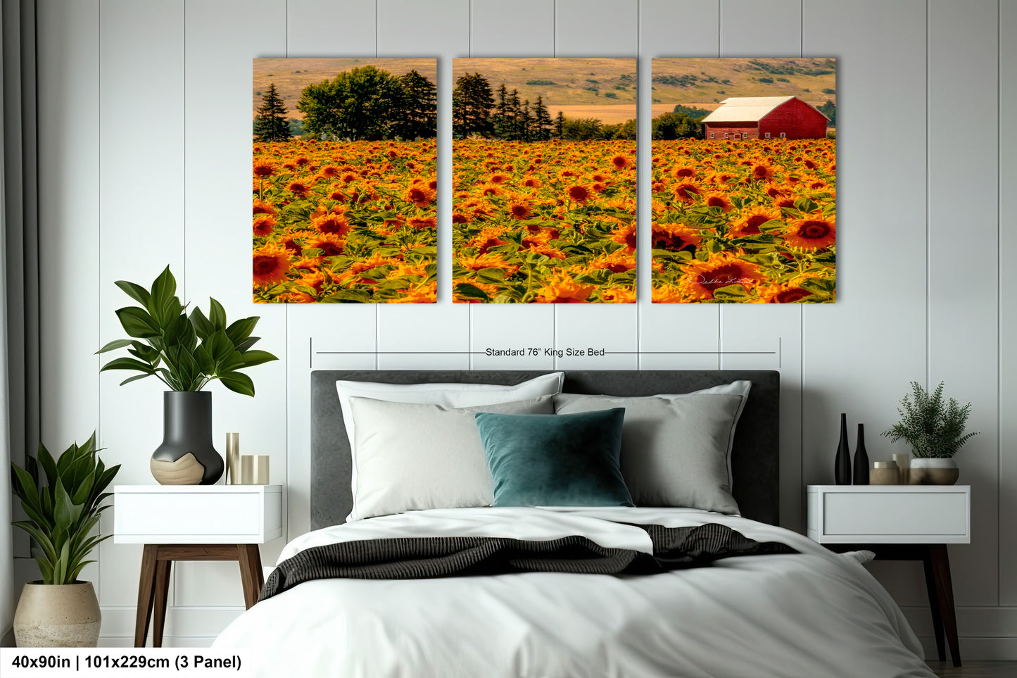 a bed room with a neatly made bed and two pictures on the wall