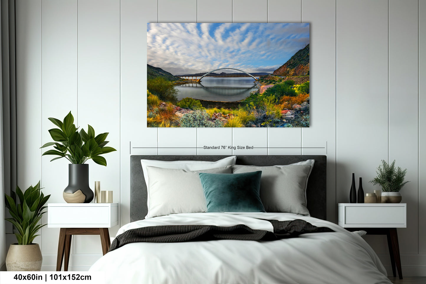 a bedroom with a bed and a painting on the wall