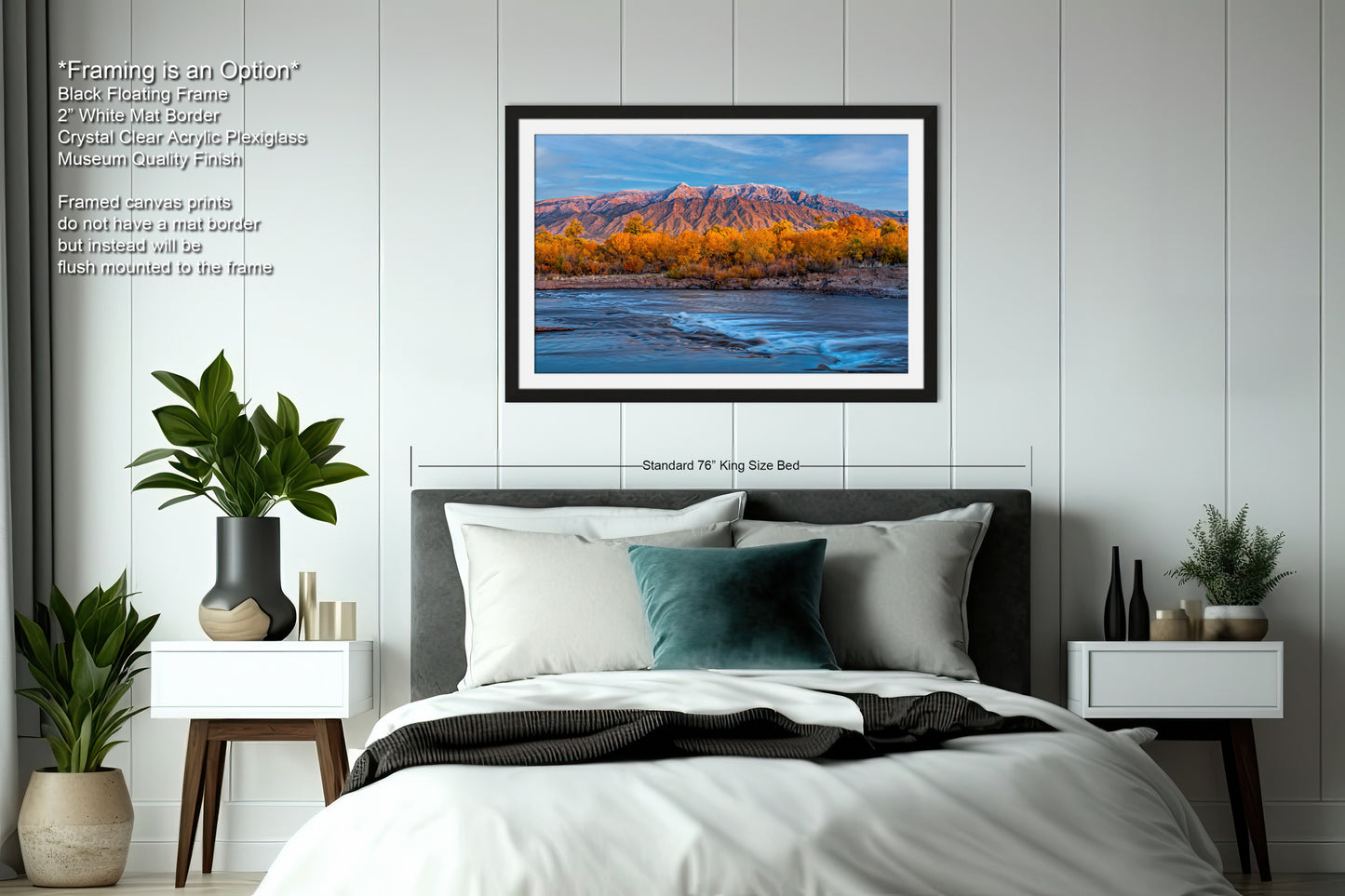 a bedroom with a bed and a picture hanging on the wall
