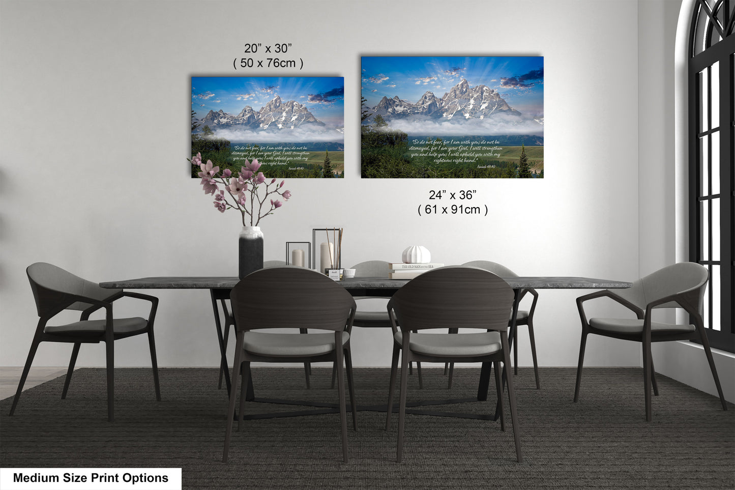 a dining room table with four chairs and a vase with flowers