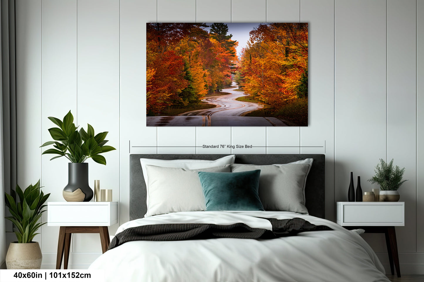 a bedroom with a bed and a painting on the wall