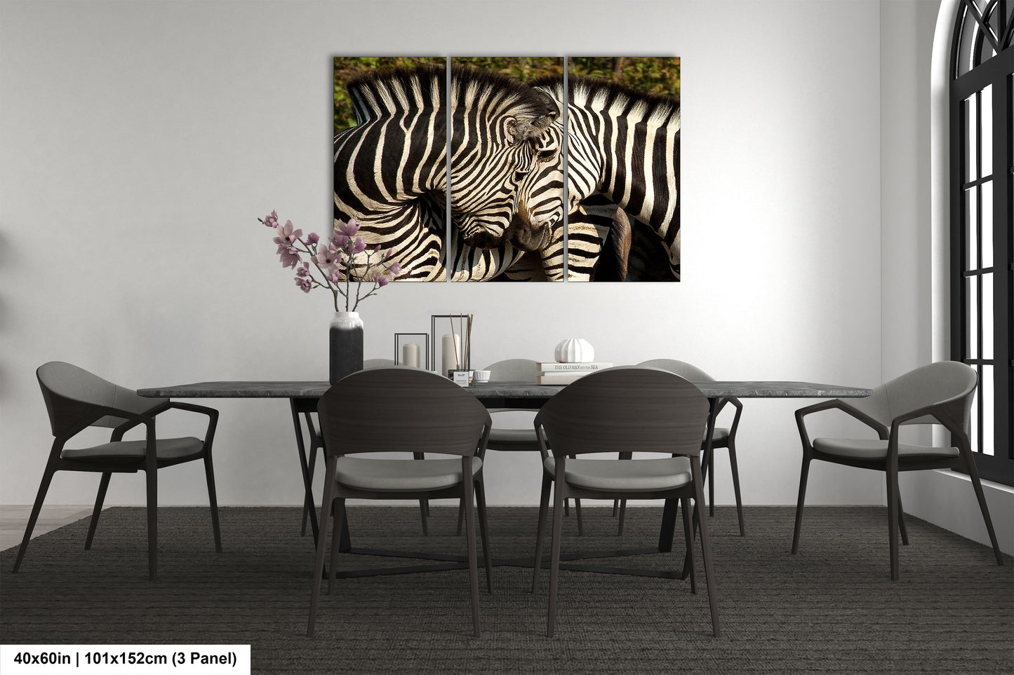 a couple of zebra standing next to each other