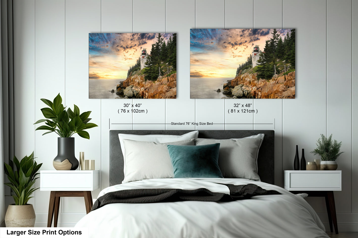 a bed with two pictures on the wall above it