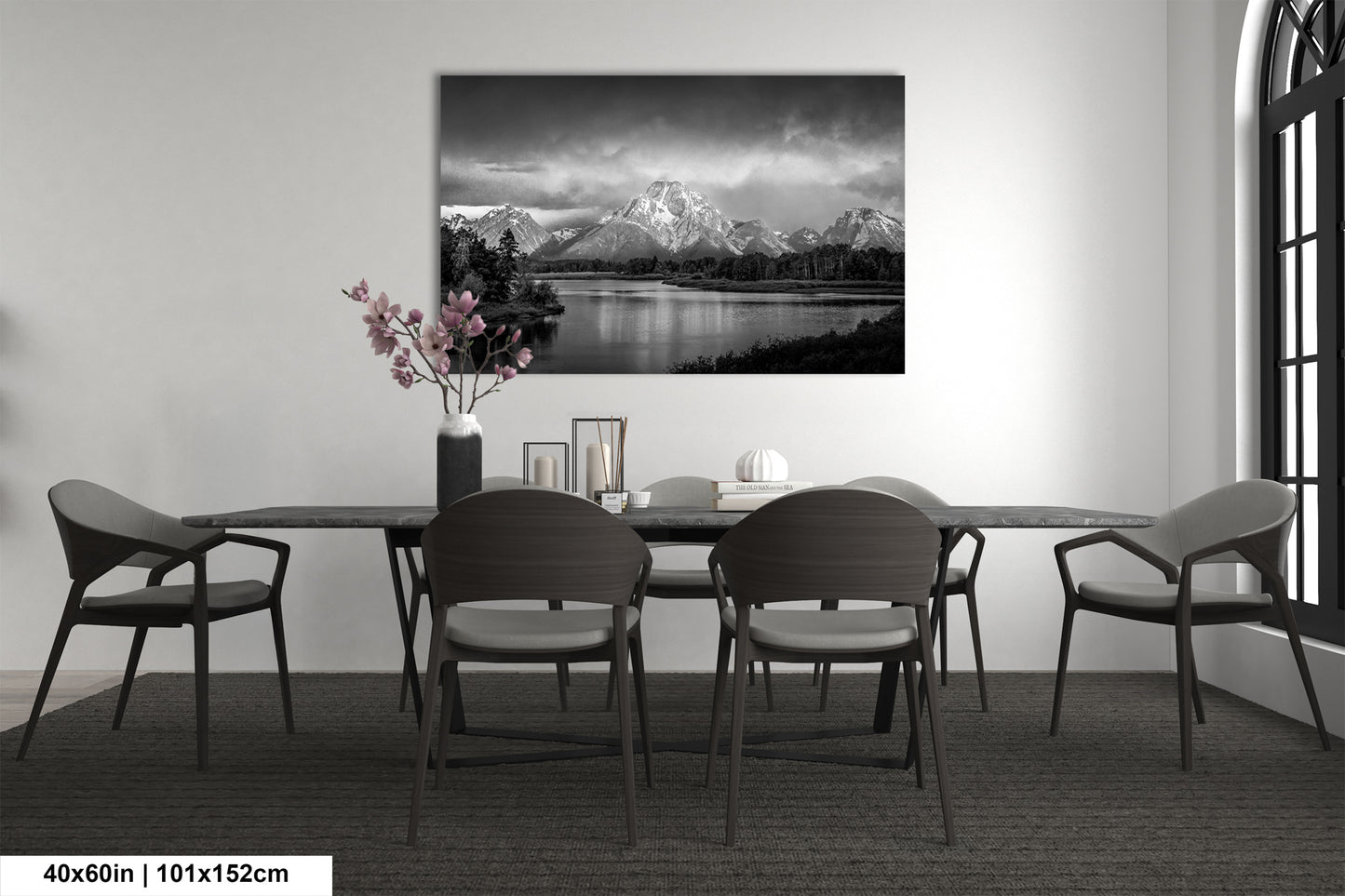 a black and white photo of a dining room table