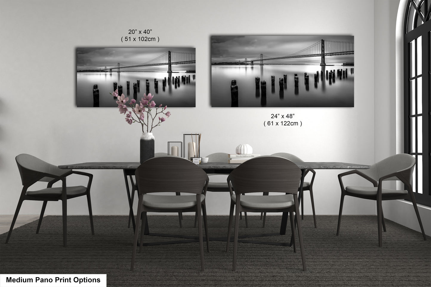 a dining room table with chairs and a vase of flowers