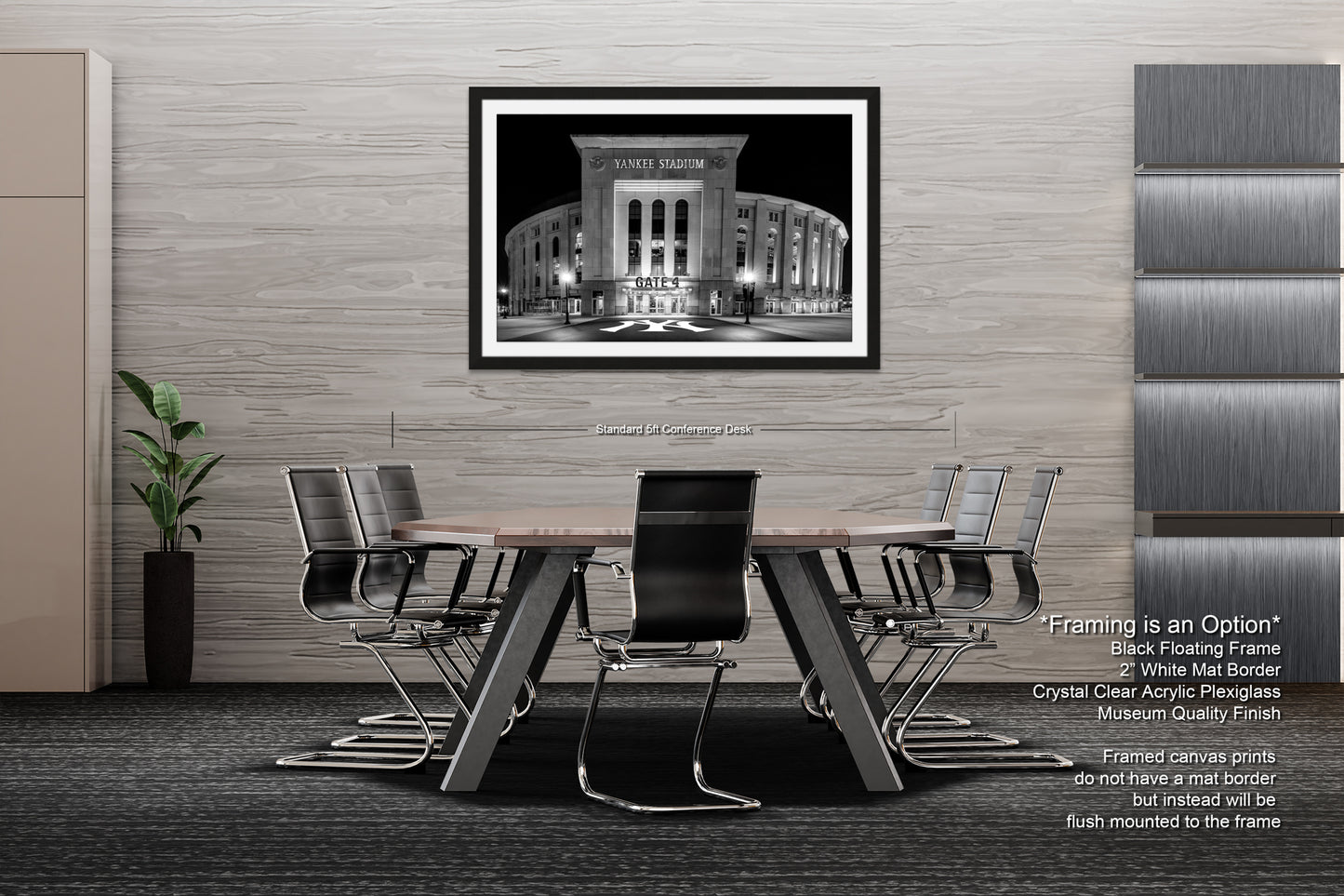 a modern office space with a large black and white photograph of a building on the wall, a wooden table surrounded by black chairs, and a plant in a black vase on the floor.