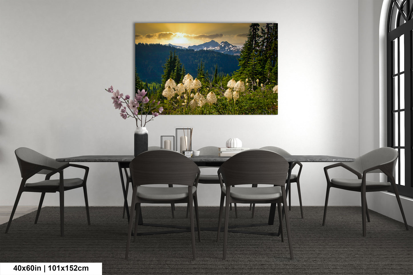 a dining room table with chairs and a vase of flowers